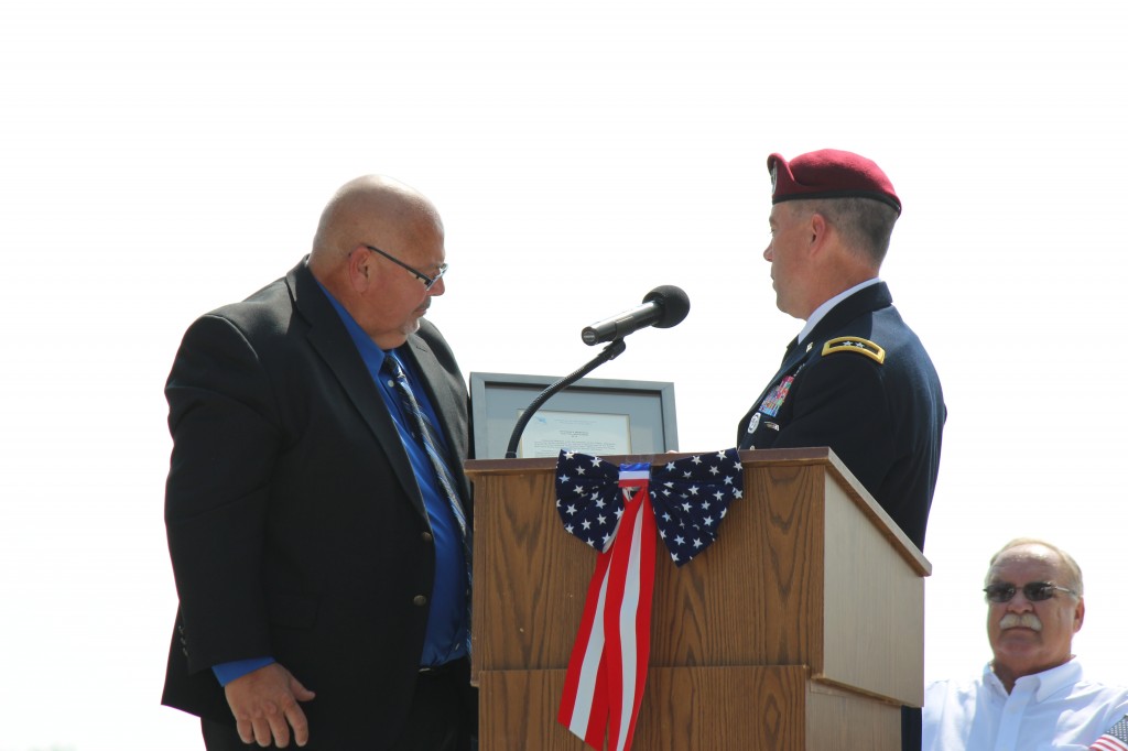 Major General Daniel Ammerman giving Chilton's Mayor a plaque from the DoD