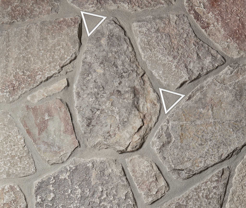 Swatch photo of Blue Ridge River Rock natural stone, showing some installation areas in masonry to watch out for.