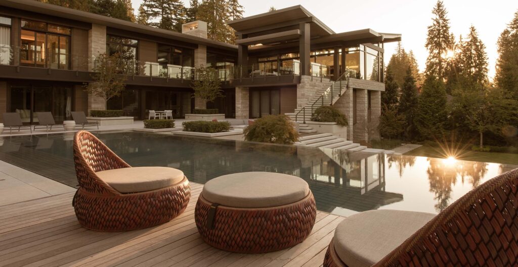 Indoor outdoor living room deck patio stone veneer exterior luxury modern rustic dream home design