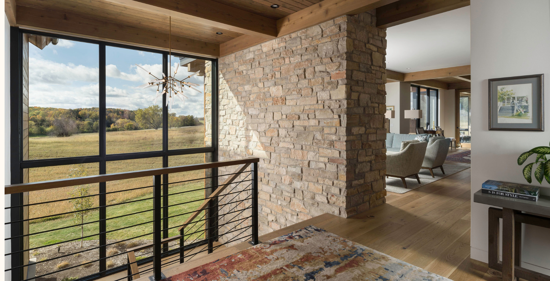 This home from Distinctive Design uses natural Chilton Rustic No Red stone as a divider between expansive windows to adapt the mountain-modern aesthetic for the Midwest